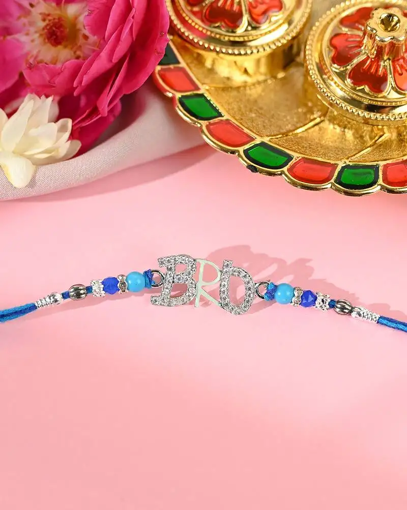 Blue thread bro letter rakhi with sparkling stones and beads
