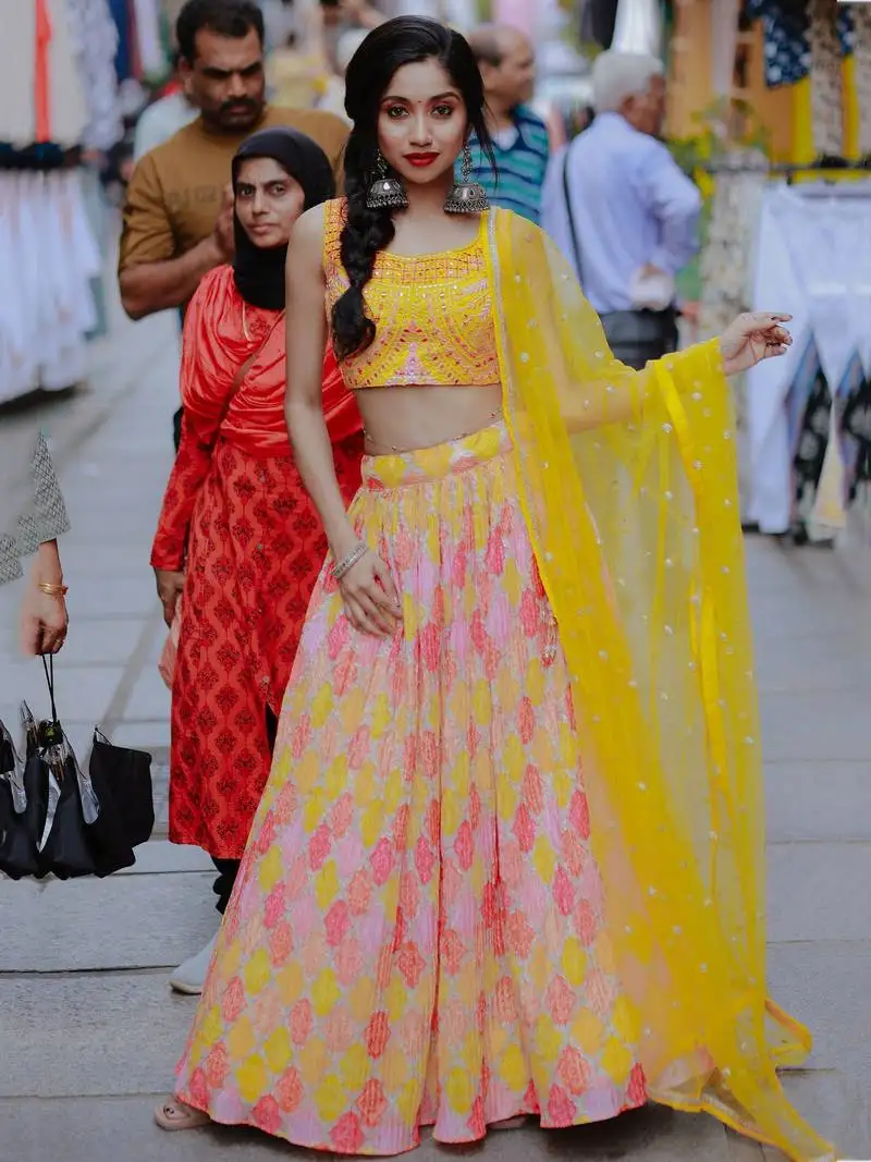 Attractive yellow printed organza haldi wear lehenga choli with dupatta