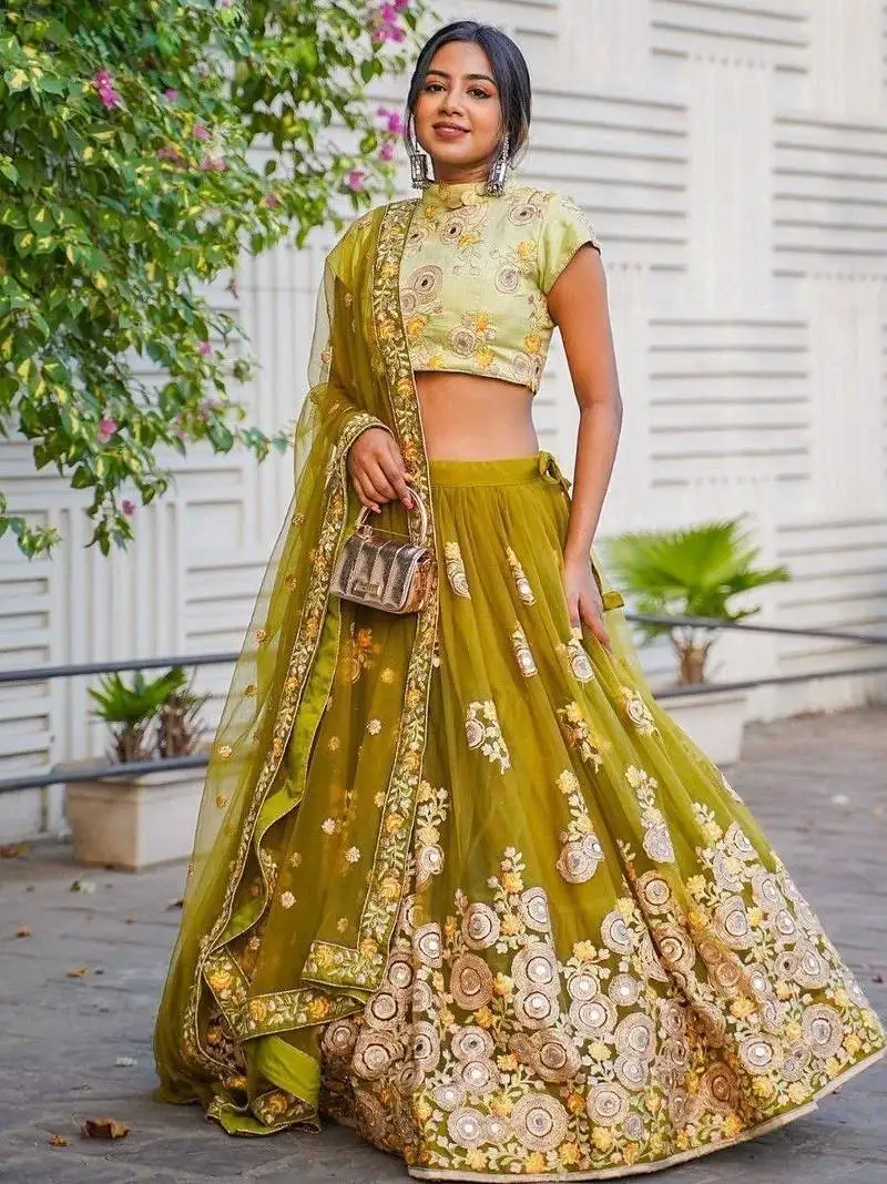 Ravishing green mirror embroidered net reception wear lehenga choli