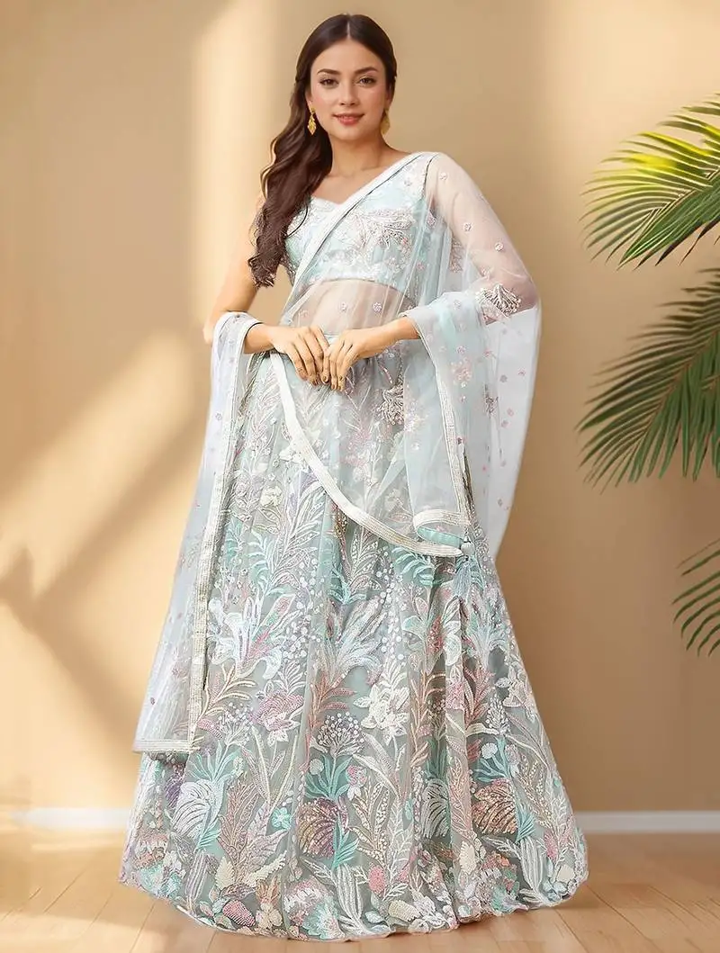 Spectacular pista green sequins net wedding wear lehenga choli