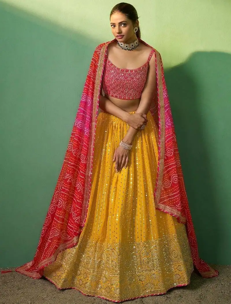 Alluring yellow sequins georgette haldi wear lehenga choli with dupatta