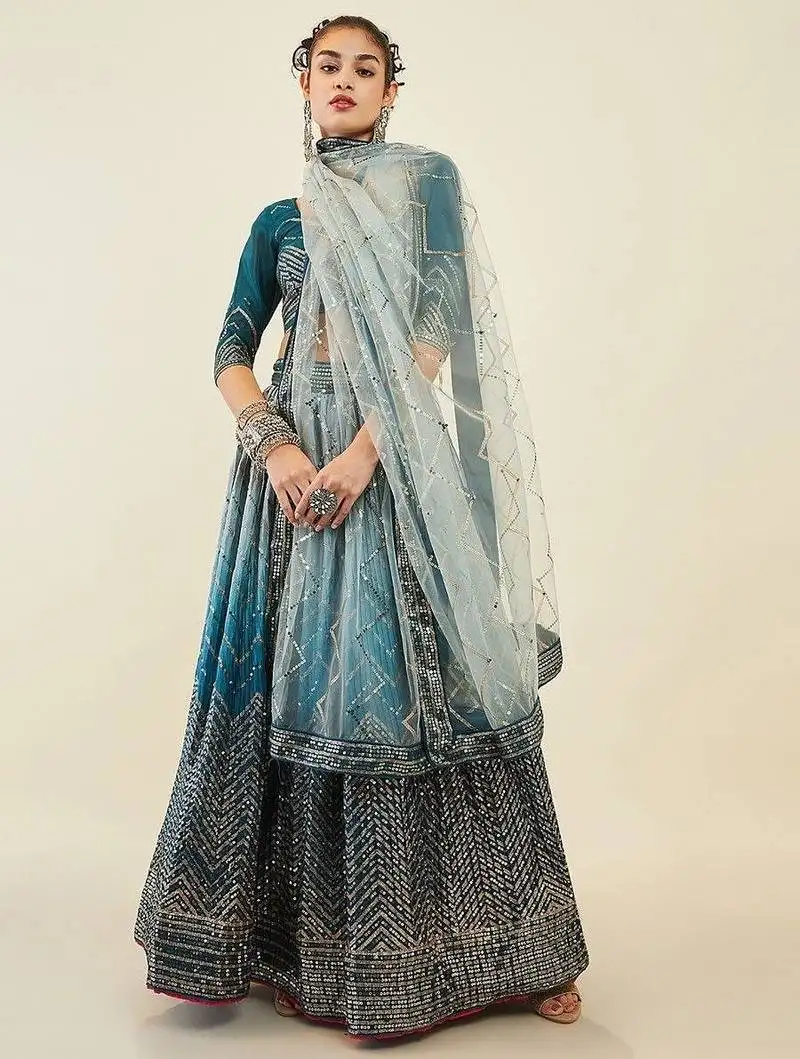 Magnetic blue sequins art silk wedding wear lehenga choli
