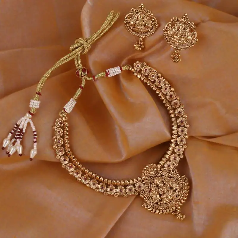 Traditional laxmi and flower design gold plated choker necklace set for women