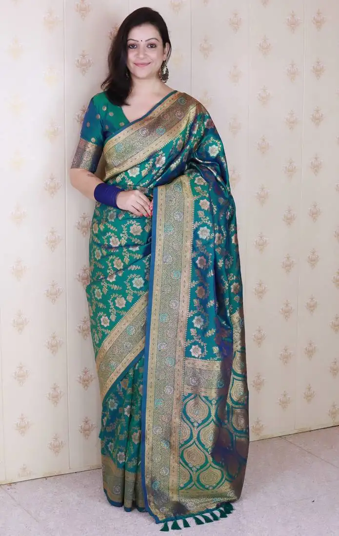 Green banarasi jaal silk blend gold zari meenakari woven saree
