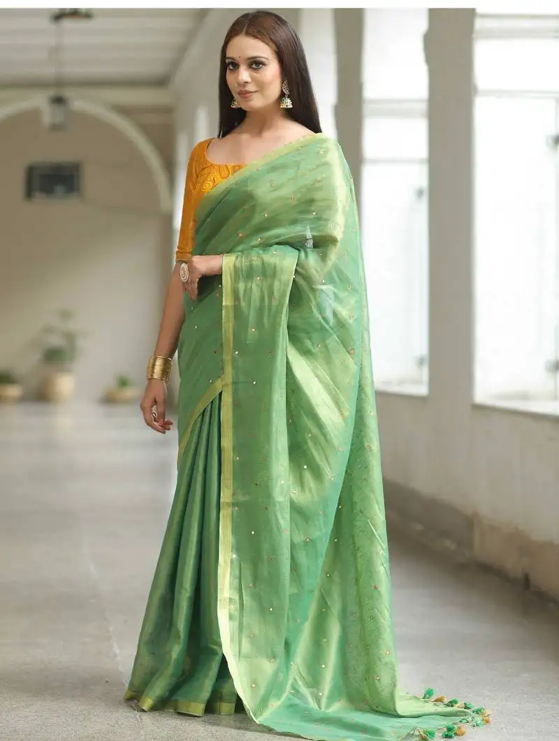 Handwoven green tissue linen saree with mirror work