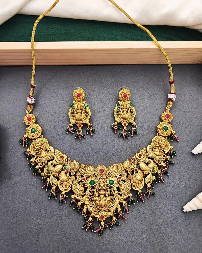 Antique gold-plated temple necklace set with lakshmi & peacock design – traditional bridal jewellery