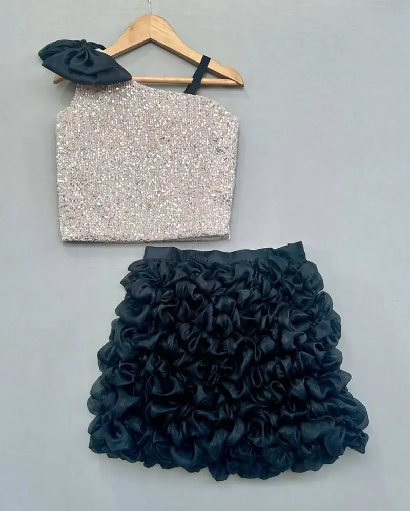 Silver sequin top with black ruffled skirt