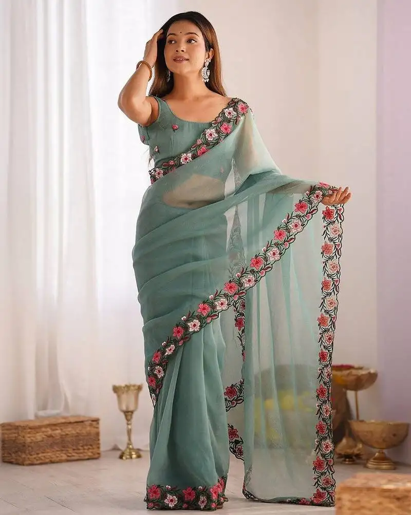 Designer heavy embroidery border tissue green saree