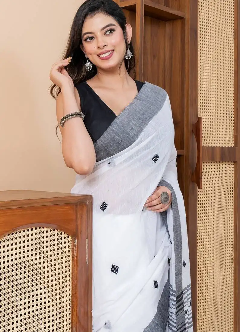 White khadi cotton with heavy jamdani palla and tassels saree