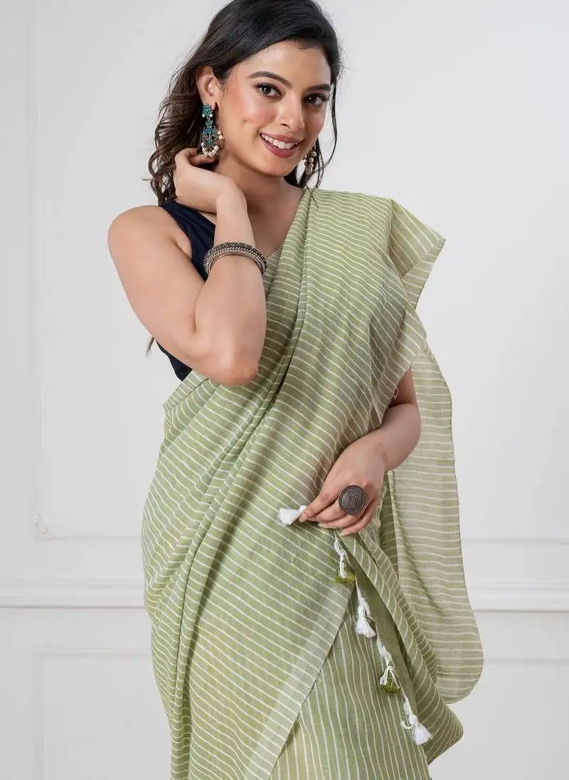 Light green khadi cotton all over stripes and tassels saree