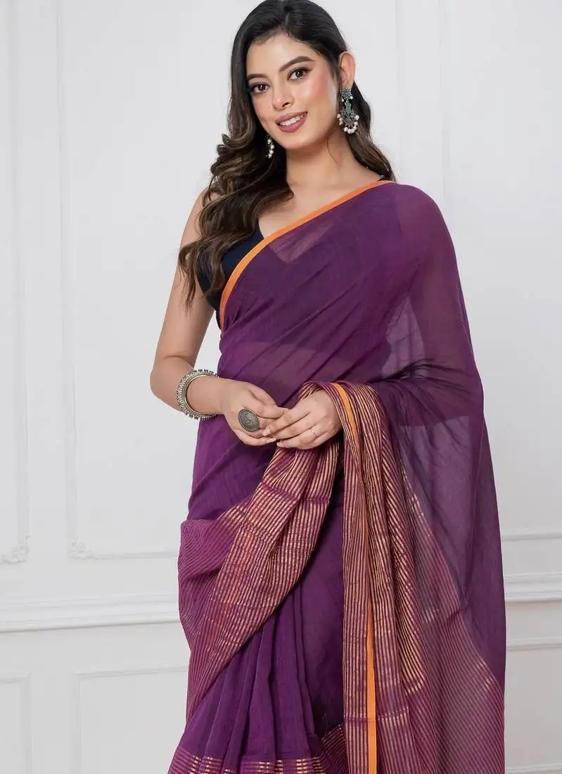 Purple solid mul cotton with zari stripes and tassels saree