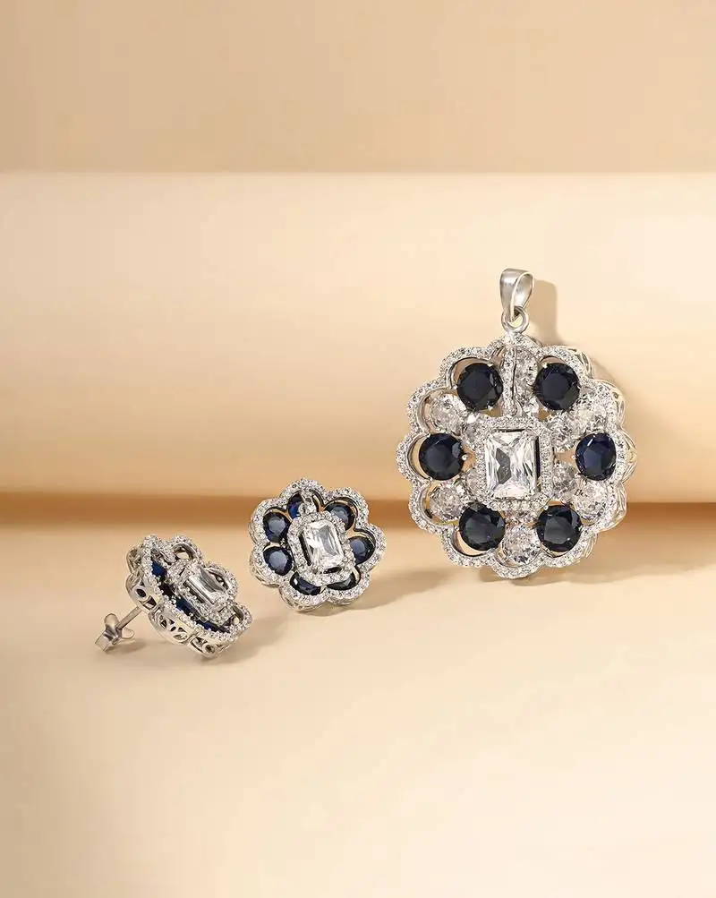 Oxidised cubic zirconia necklace set with textured blossom design