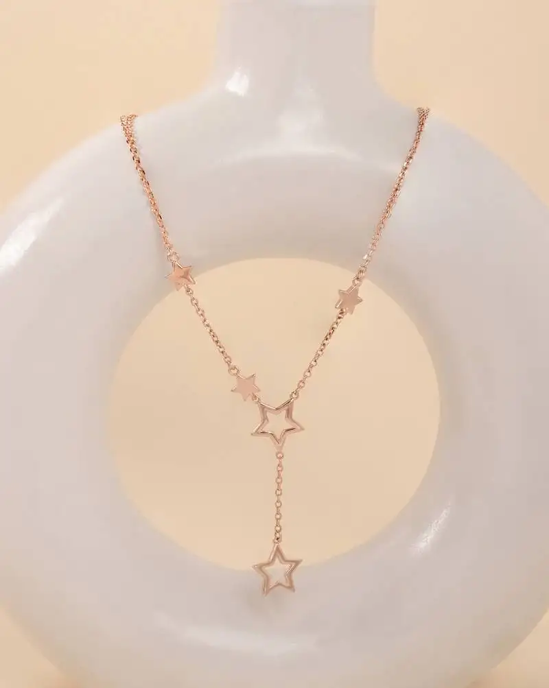 Star-shaped cz rose gold pendant necklace with celestial design and sparkling finish