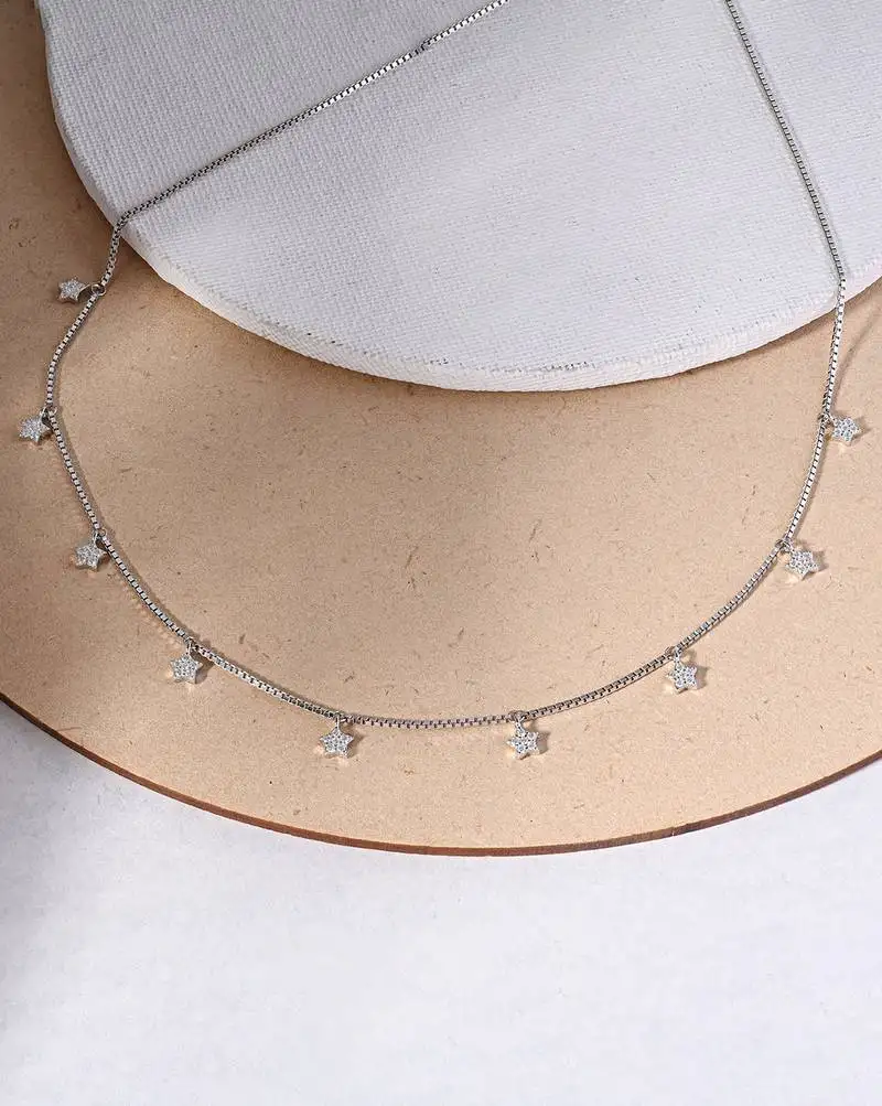 Star charm silver necklace with cube chain and everyday celestial look