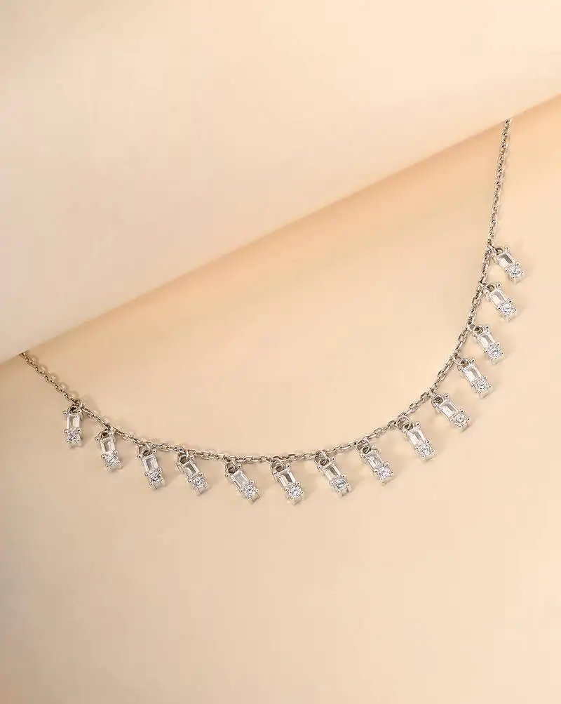 Multi-charm cz silver necklace with beads and playful detail