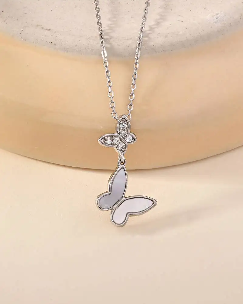 Butterfly double charm silver necklace with symbol of transformation and grace