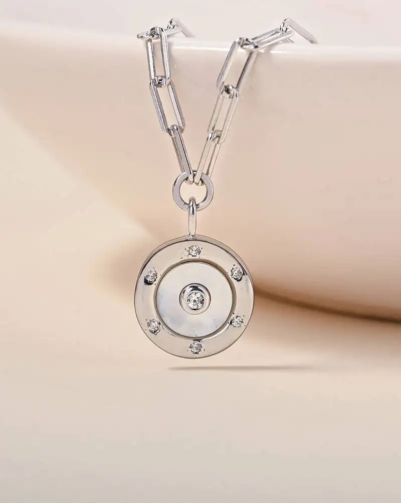 Hexagon cz cluster silver necklace with circular design and radiant center stone