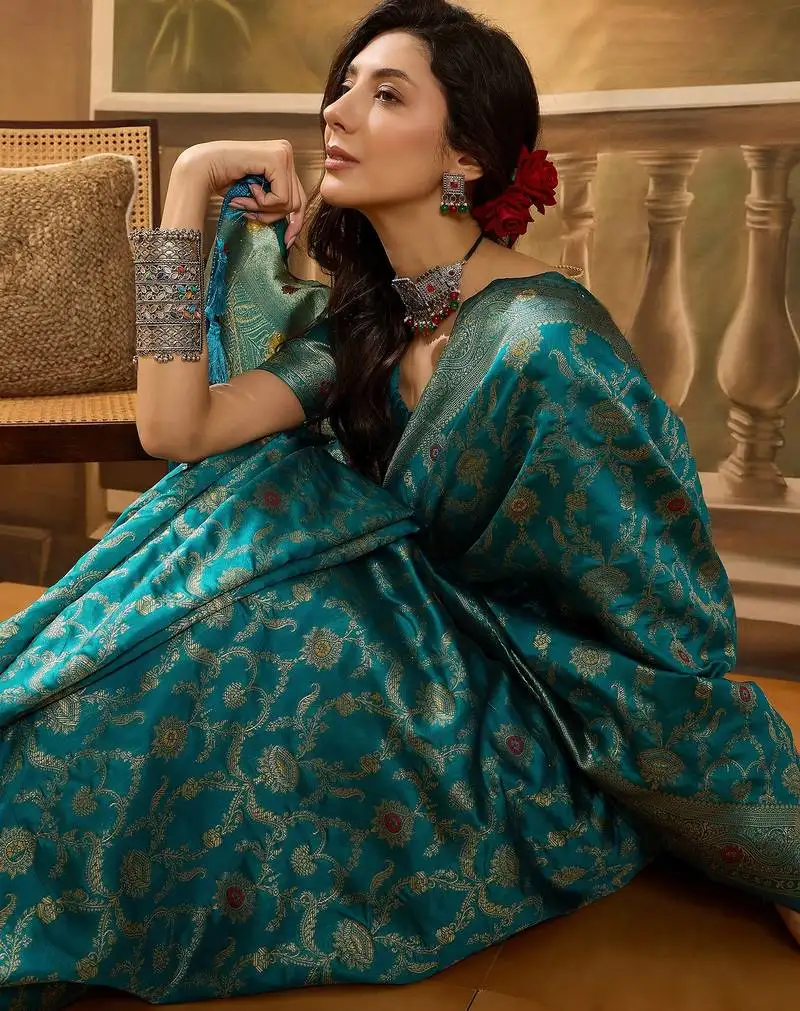Teal blue banarasi jacquard saree with zari weaving & tassel pallu unstitched blouse material included