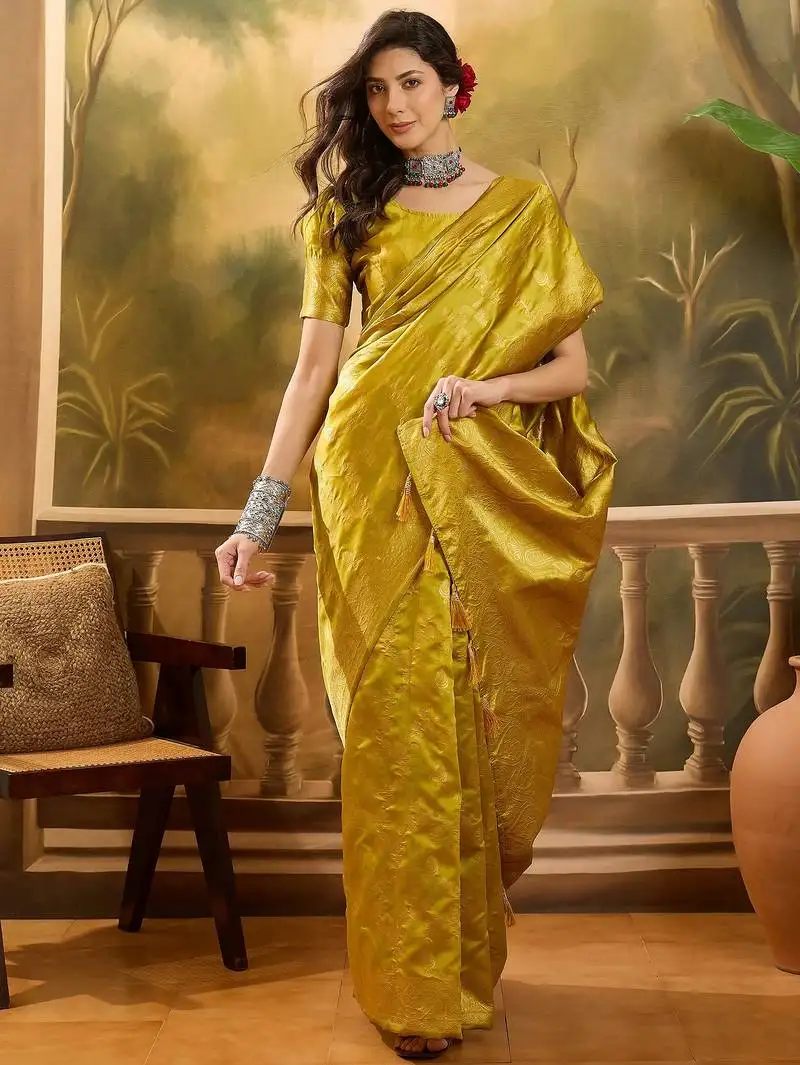 Golden banarasi jacquard saree with elegant zari weaving & tassel detailed pallu unstitched blouse