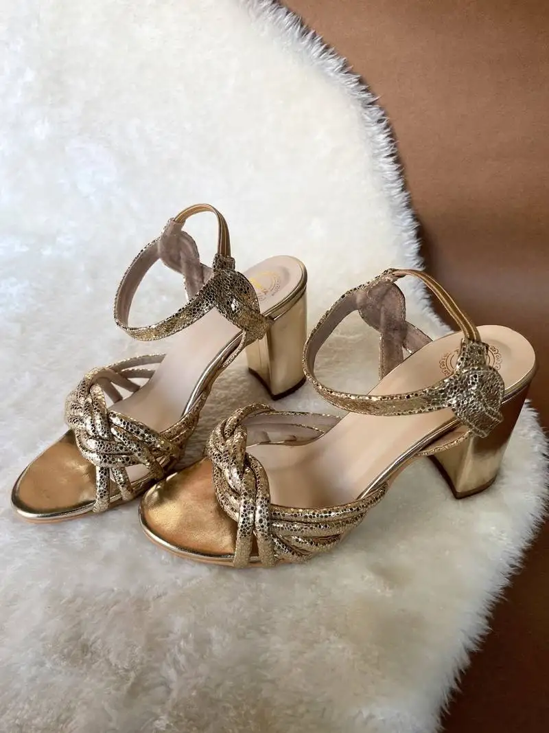 Gold embroidered leather heels