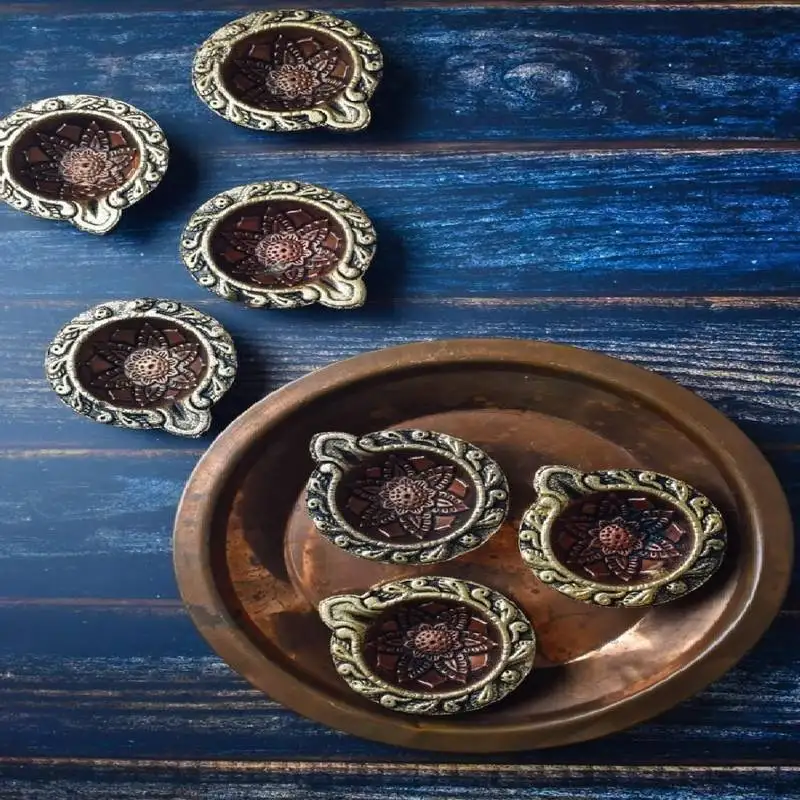 The handicraftian curve diya set of 12