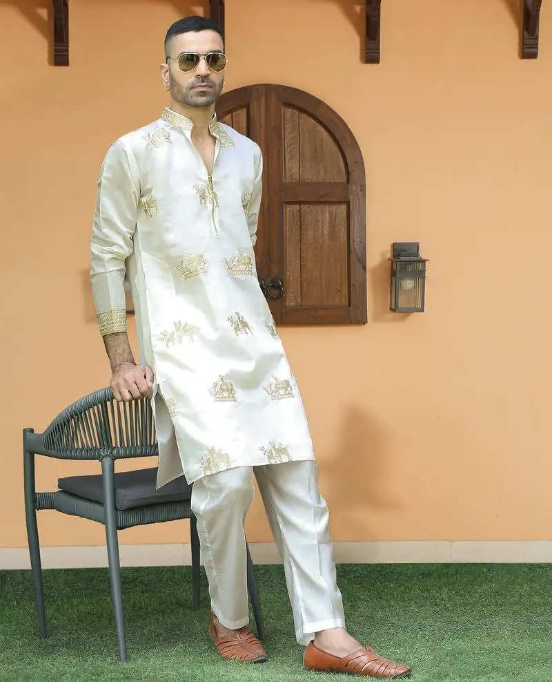 Cotton silk ethnic motifs embroidered cream kurta with trouser pant