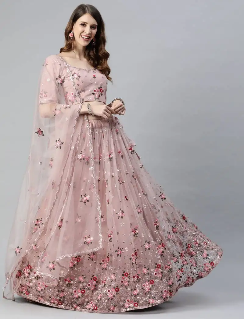 Enchanting light pink embroidered net wedding lehenga choli with dupatta