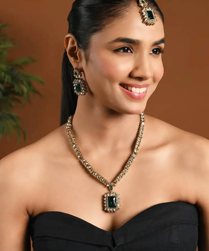 Gold plated stylish design crystal diamond necklace with earrings & maang tikka jewellery set for women