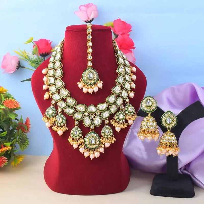 Ethnic gold color kundan necklace set with wedding stone details