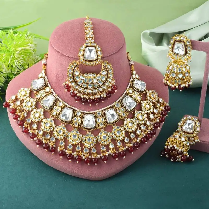 Rich maroon color kundan necklace set for engagement ceremonies