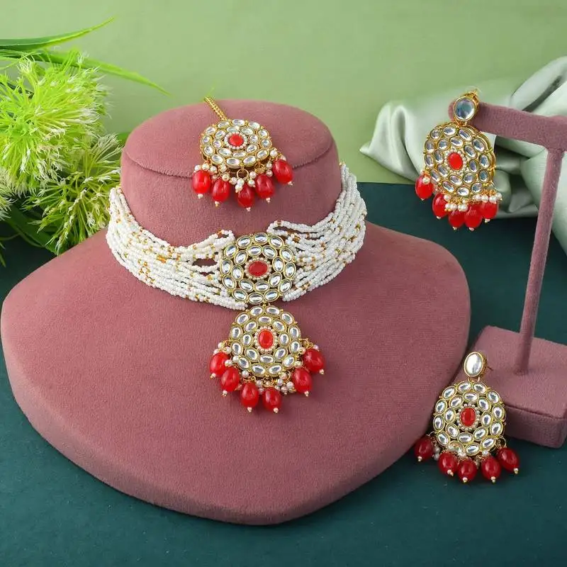 Vibrant red color choker kundan necklace set with classic embellishment