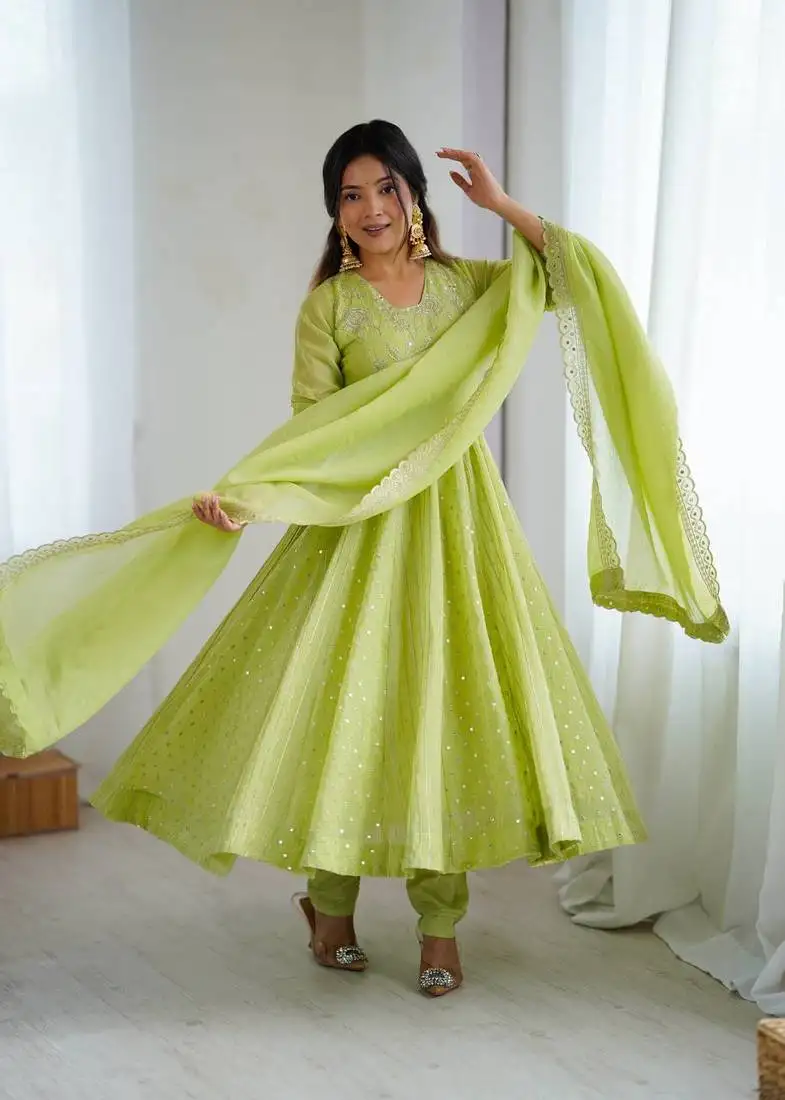 Pista green color heavy crunchy silk embroidery work gown stitched