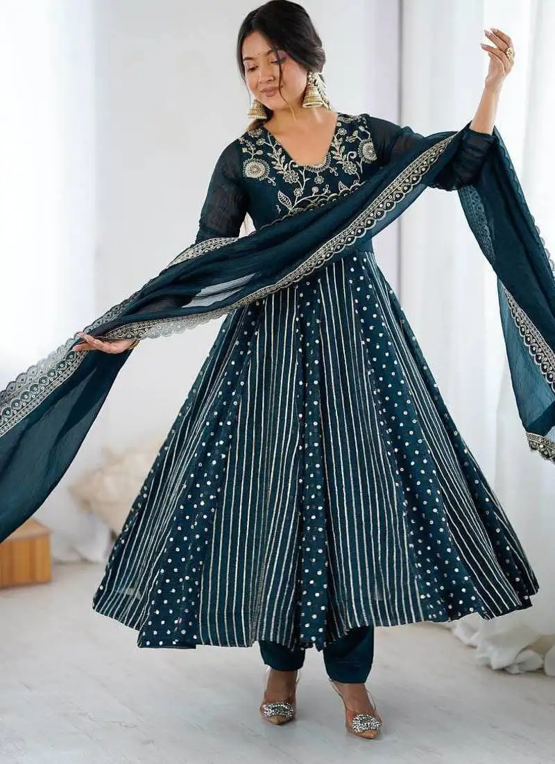 Teal color heavy crunchy silk embroidery work gown stitched