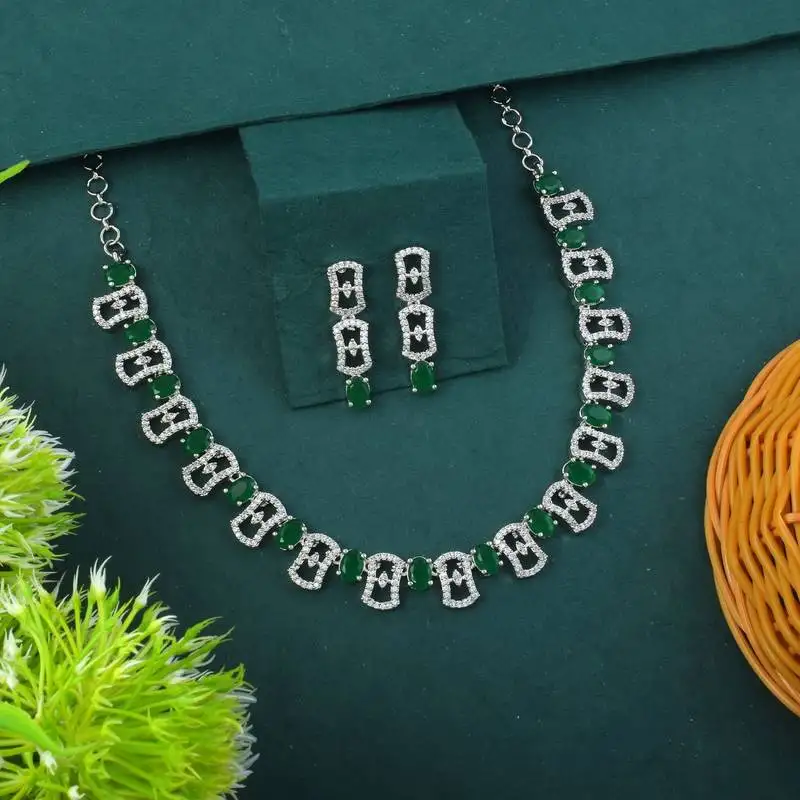 Green color american diamond necklace set adorned with classic stone design