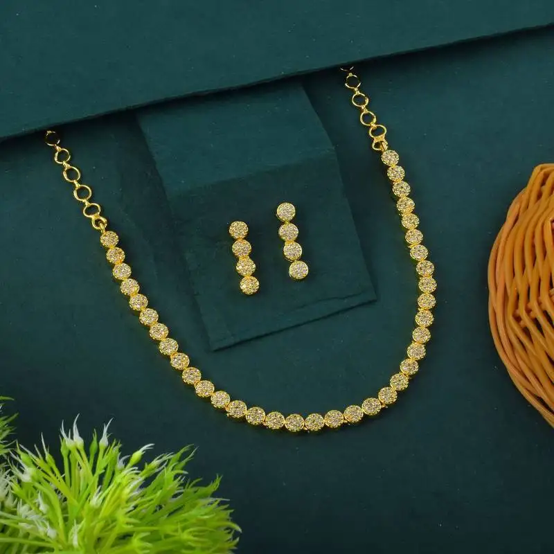 Gold color american diamond necklace set with diamond-like centerpiece charm