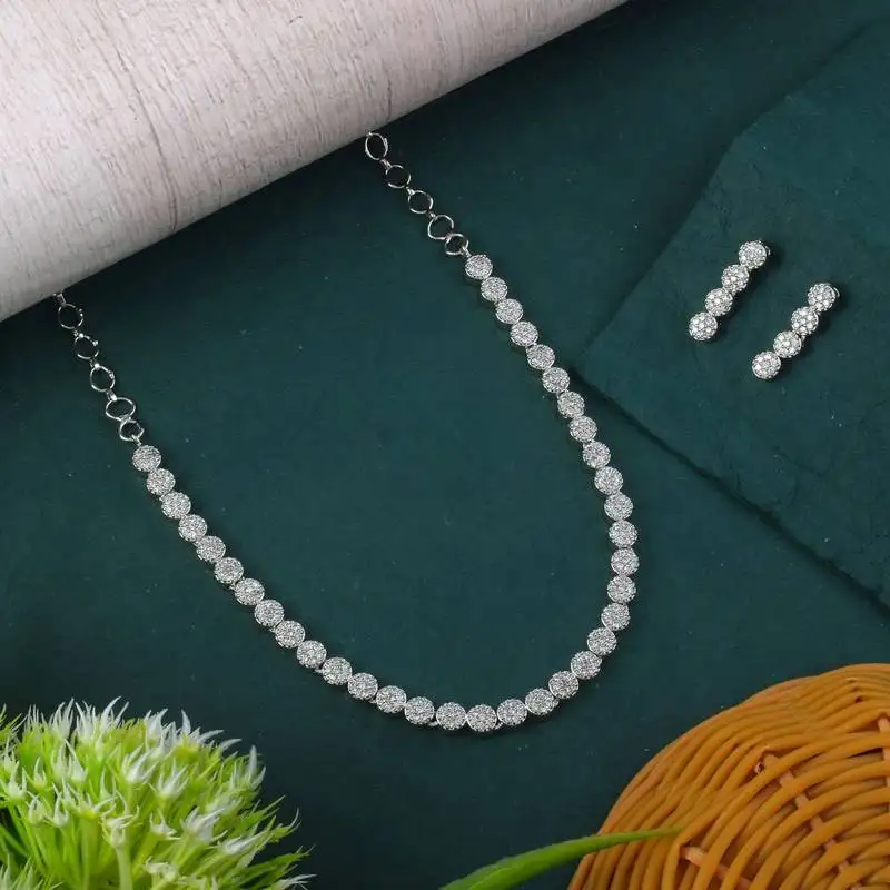Silver color american diamond necklace set with pearl-like embellishments