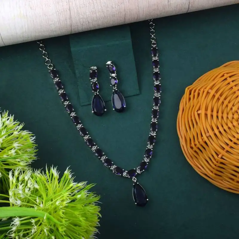Purple color american diamond necklace set in stylish traditional pattern