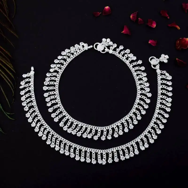 Beautiful silver color anklets designed with traditional indian artistic craft for wedding events