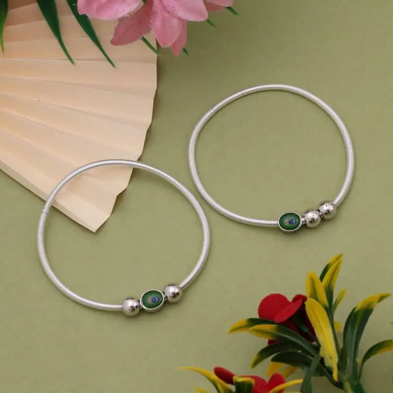 Traditional silver color peacock feather anklet with antique detailing for women and girls