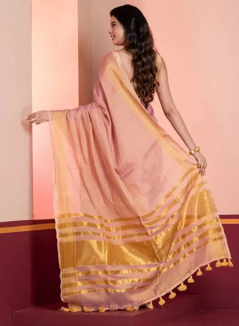 Pastel pink dual tone linen tissue saree with zari and tassels, with blouse