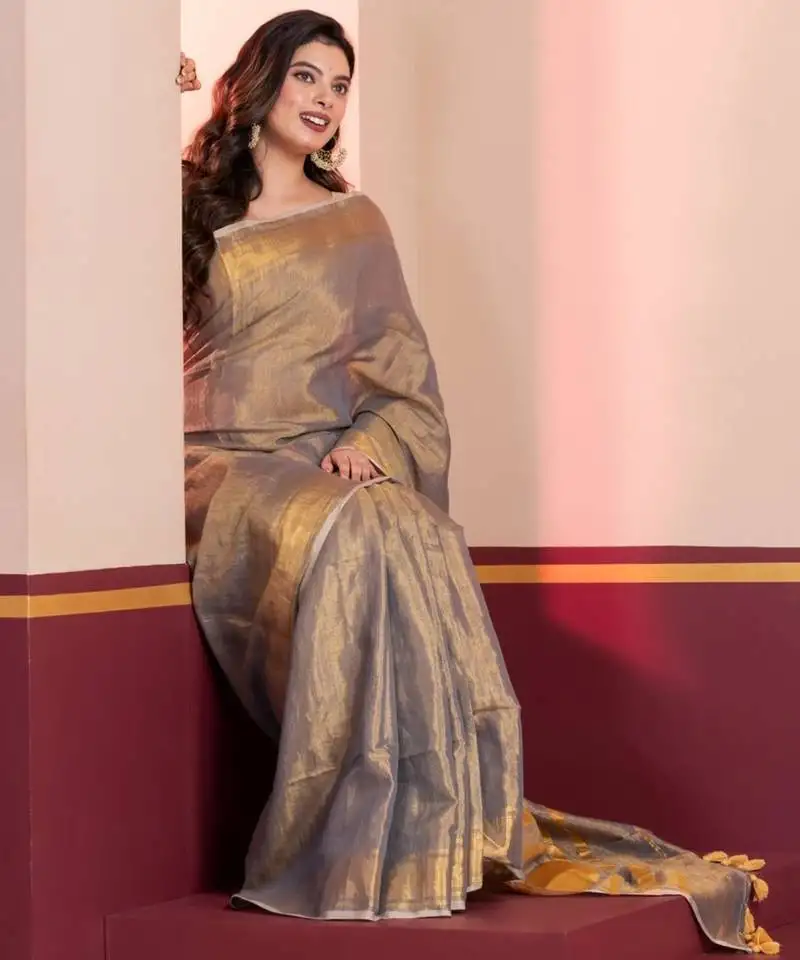 Grey gold dual tone linen tissue saree with zari and tassels, with blouse