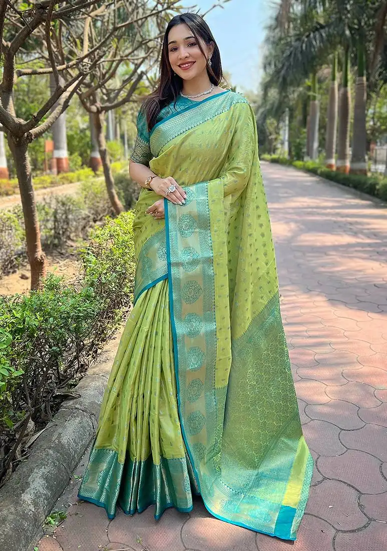 Pista woven designer tissue silk saree with blouse piece