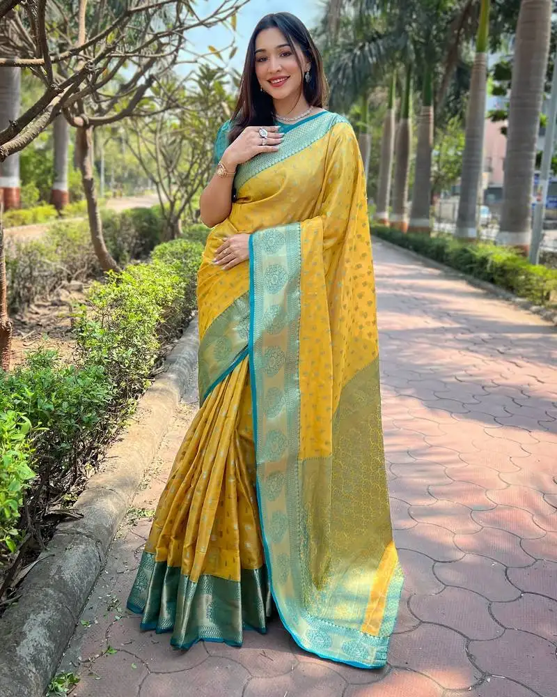 Yellow woven designer tissue silk saree with blouse piece