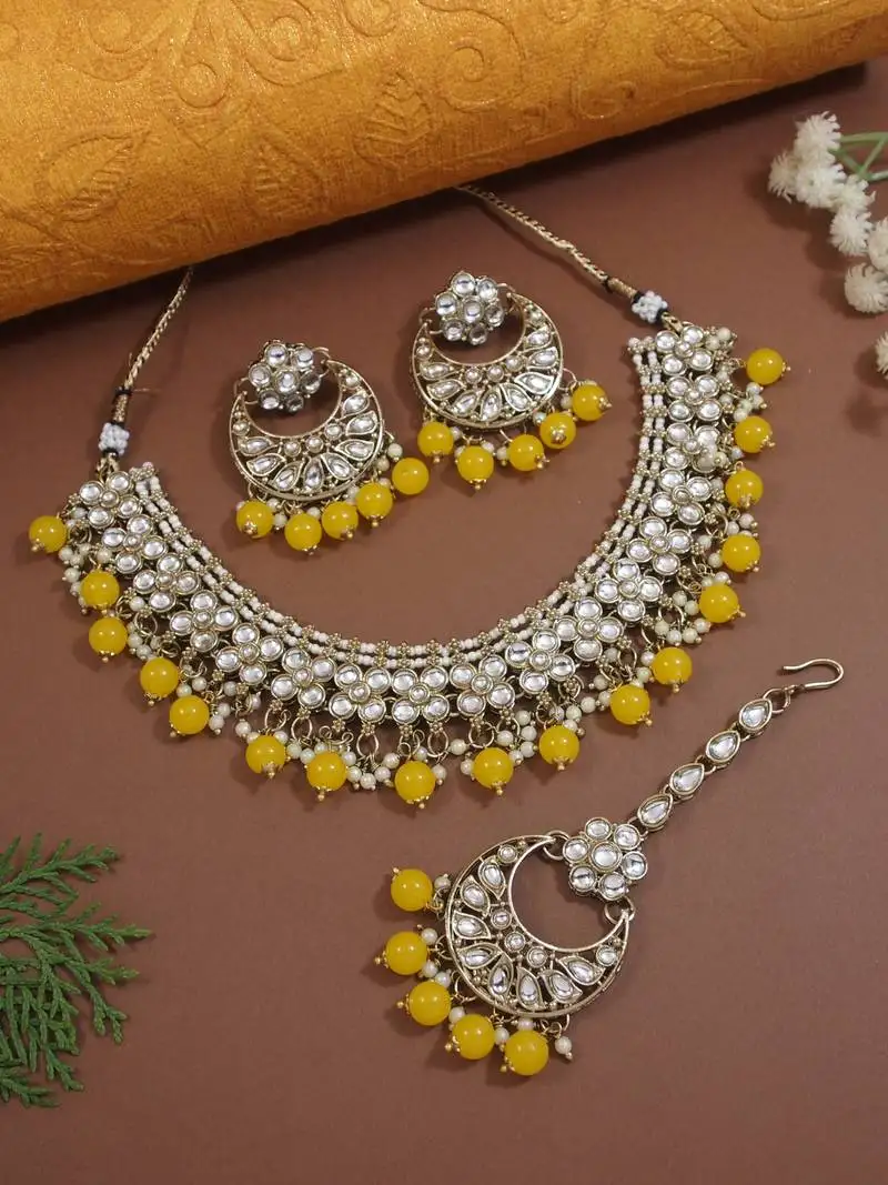 Gold plated traditional floral kundan pearl choker necklace jewelry earrings & maang tikka set for women (yellow)