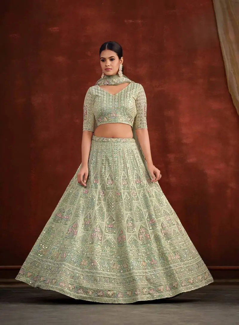 Pista green net silk party wear lehenga with heavy embroidery blouse