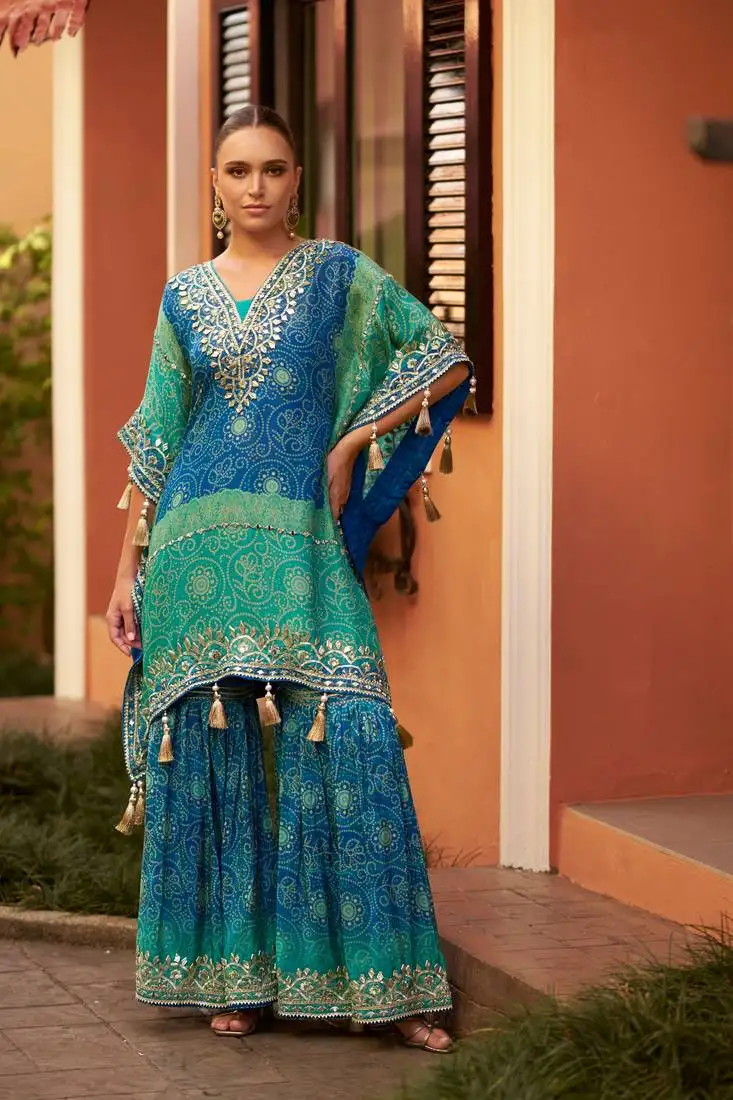 Turquoise & blue chinnon kaftan suit with embroidery, sequins, mirror, gota & tassel work, free size up to 42" stitched