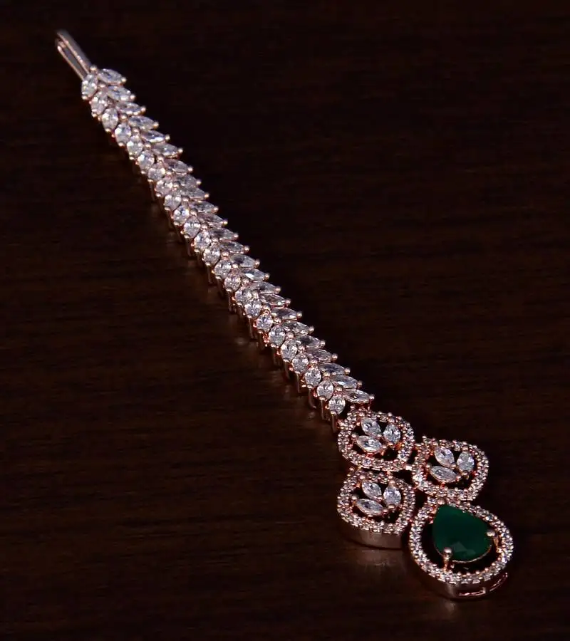 Rose gold plated emerald and ad stone embellished designer tikka 217mts122
