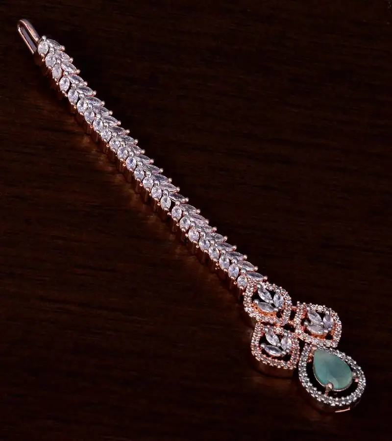 Rose gold plated mint and ad stone embellished designer tikka 217mts123