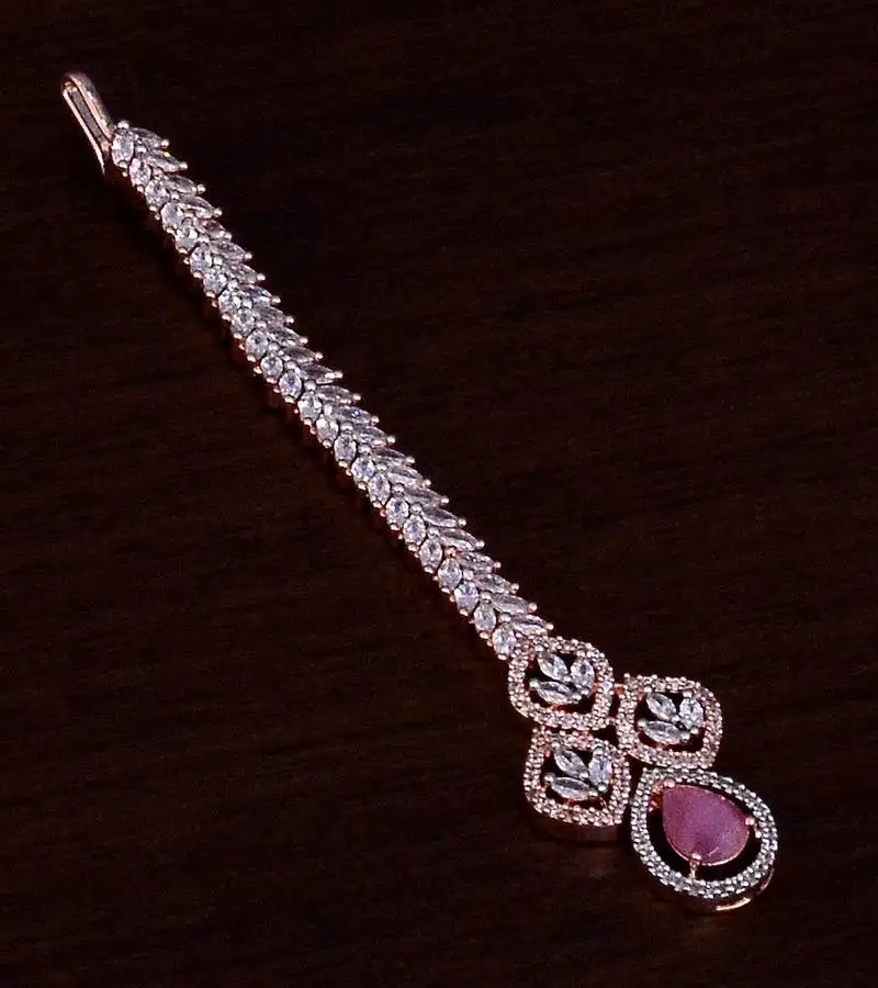 Rose gold plated baby pink and ad stone embellished designer tikka 217mts124