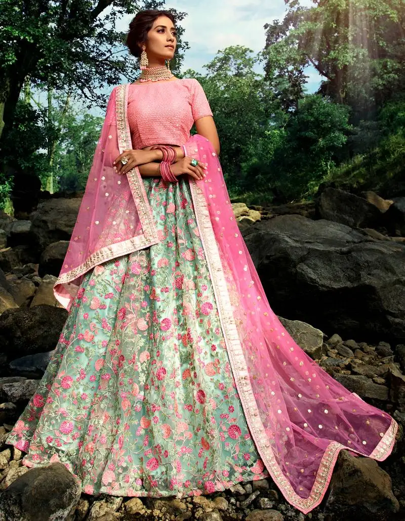 Exquisite pista green sequins zari and thread embroidery net semi stitched lehenga choli for wedding